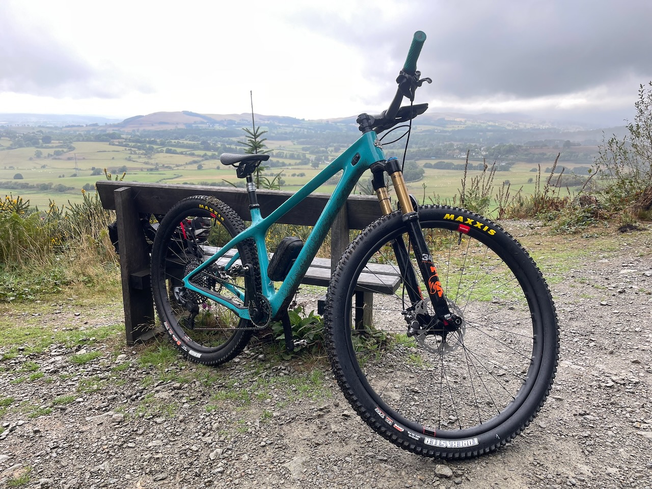 The turquoise Yeti ARC overlooking a valley under cloudy skies